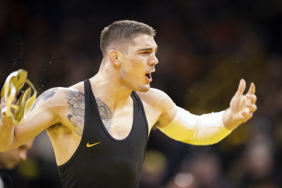 Iowa’s No. 11 184-pound Abe Assad wins over Oklahoma State’s No. 10 Travis Wittlake by decision 3-2 during a wrestling meet between No. 2 Iowa and No. 6 Oklahoma State in Carver-Hawkeye Arena on Sunday Feb. 19, 2023. The Hawkeyes defeated the Cowboys, 28-7. 