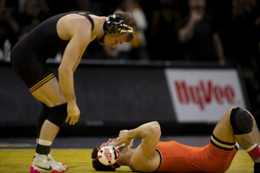 Iowa’s No. 1 nationally ranked 125-pound Spencer Lee stands after defeating Oklahoma State’s Reece Witcraft during a wrestling dual between No. 2 Iowa and No. 6 Oklahoma State at Carver-Hawkeye Arena on Sunday Feb. 19, 2023. The Hawkeyes defeated the Cowboys 28-7.