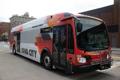 A Proterra ZX5 electric bus operated by Iowa City Transit is seen at a downtown interchange in Iowa City on Feb. 21, 2023.