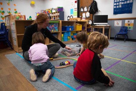 Hannah Hudson plays with trains with children at Lionheart Early Learning on Wednesday Feb. 22, 2023. Hudson is a childcare provider who could be impacted by the Johnson County Wage Enhancement program, which will be implemented in April.