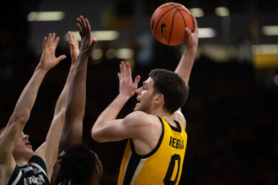 Iowa forward Filip Rebraca jumps for an opening during a men’s basketball game between Iowa and Michigan State at Carver-Hawkeye Arena in Iowa City on Saturday, Feb. 25, 2023. The Hawkeyes defeated the Spartans, 112-106. Rebraca scored 18 points and 5 assists.