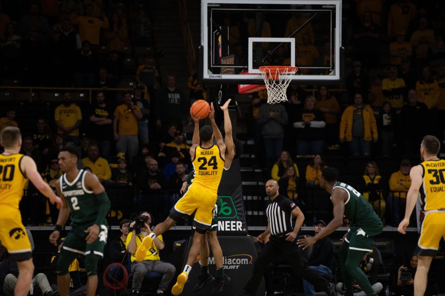 Iowa forward Kris Murray jumps to score during a men’s basketball game between Iowa and Michigan State at Carver-Hawkeye Arena in Iowa City on Saturday, Feb. 25, 2023. The Hawkeyes defeated the Spartans, 112-106. Murray scored 26 points and 4 assists.