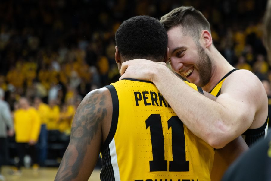 Iowa guard Tony Perkins celebrates with Iowa guard Connor McCaffery during a men’s basketball game between Iowa and Michigan State at Carver-Hawkeye Arena in Iowa City on Saturday, Feb. 25, 2023. The Hawkeyes defeated the Spartans, 112-106.
