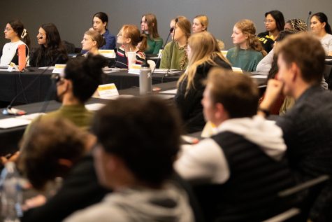 Senators listen to speakers at a University Student Government meeting in the Black Box Theater in the Iowa Memorial Union on October 17, 2022.