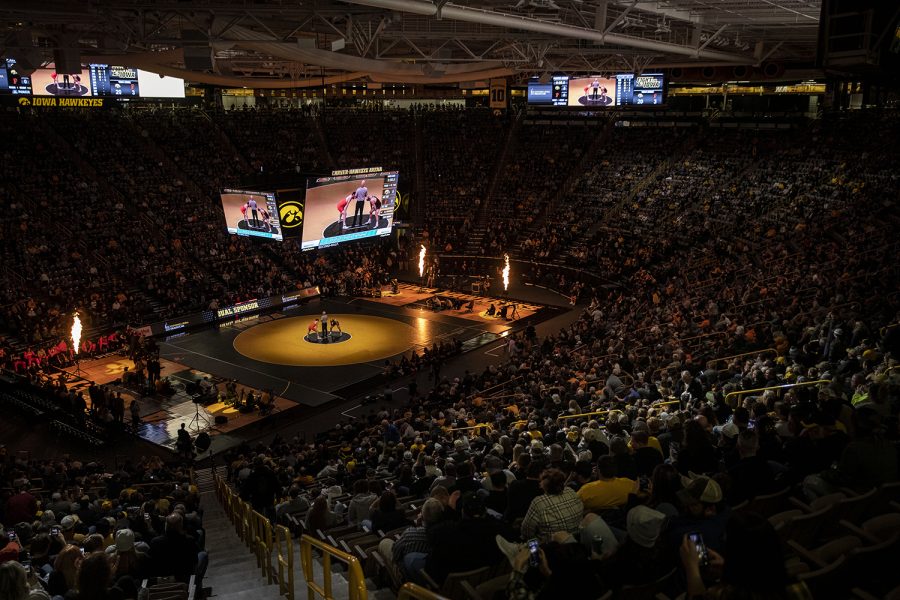 Iowa 165-pound Alex Marinelli and Princeton’s Grant Cuomo take the mat during a season opener dual wrestling meet between No. 1 Iowa and No. 21 Princeton at Carver-Hawkeye Arena on Friday, Nov. 18, 2021. The Hawkeyes defeated the Tigers with a team score of 32-12.