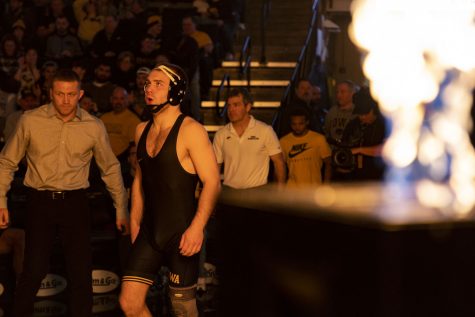 No. 7 nationally ranked 165-pound Iowa’s Patrick Kennedy walks towards the mat during a wrestling dual between No. 2 Iowa and No. 9 Michigan at Carver-Hawkeye Arena on Friday, Feb. 10, 2023. The Hawkeyes defeated the Wolverines 33-8.