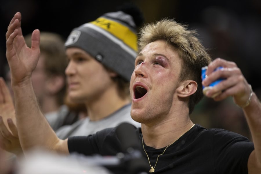 Sixth-ranked 149-pounder Max Murin cheers with his team during a wrestling dual between No. 2 Iowa and No. 9 Michigan at Carver-Hawkeye Arena on Friday, Feb. 10, 2023. The Hawkeyes defeated the Wolverines, 33-8.
