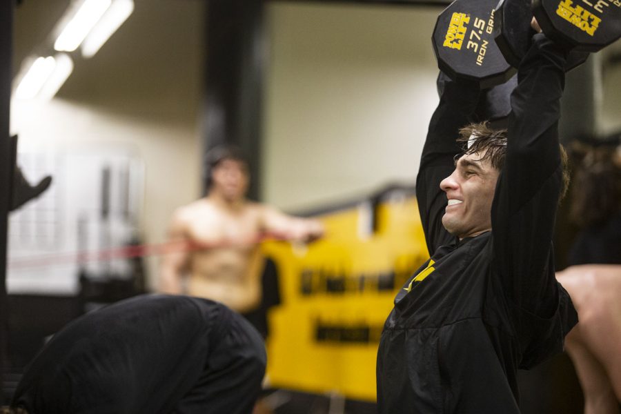 Iowa’s 133-pound Austin DeSanto lifts weights during a practice at the Dan Gable Wrestling Complex in Carver-Hawkeye Arena on Saturday, Jan. 22, 2022. DeSanto’s career record inside Carver-Hawkeye Arena was 18-3. 