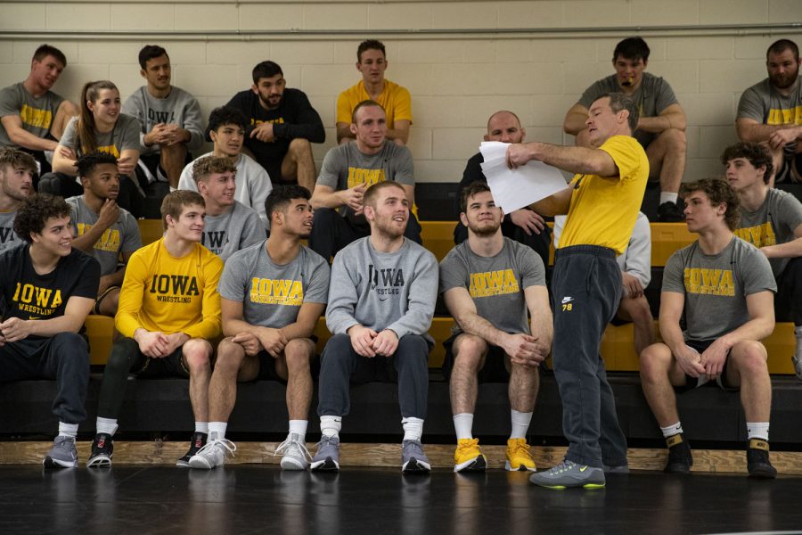 Iowa head coach Tom Brands gestures towards a paper in front of his wrestlers before a wrestling practice at the Dan Gable Wrestling Complex in Carver-Hawkeye Arena on Friday, Dec. 17, 2021. As head coach, Brands has collected four NCAA team titles and six Big Ten team titles. 

The documentary Chasing Greatness: Wrestling Life, is a film that captures the historic Iowa wrestling program’s quest for back-to-back titles. Filmmakers from The Daily Iowan Documentary workshop followed the team for the entire 2021-22 wrestling season. The documentary team recorded every practice, competition and team gathering throughout the course of six months recording approximately 300 hours of footage. (Ayrton Breckenridge/The Daily Iowan)