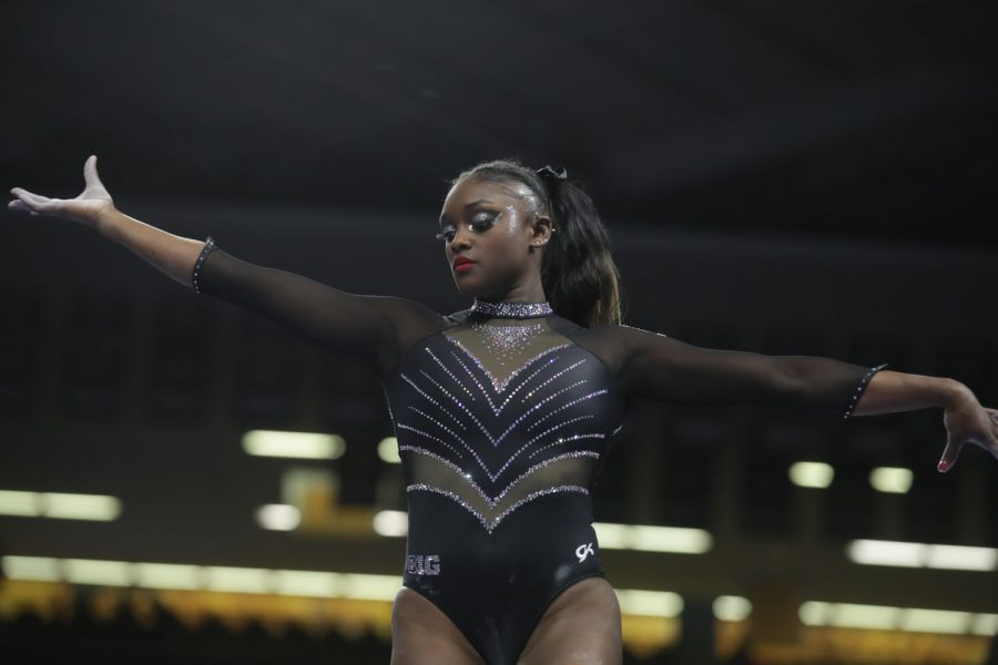 Iowa gymnast JerQuavia Henderson competes on the beam during a gymnastics meet between Iowa and Minnesota in Iowa City on Friday, Jan. 27, 2023. The Hawkeyes and the Gophers tied with each getting a score 196.875. (Lillie Hawker/The Daily Iowan)