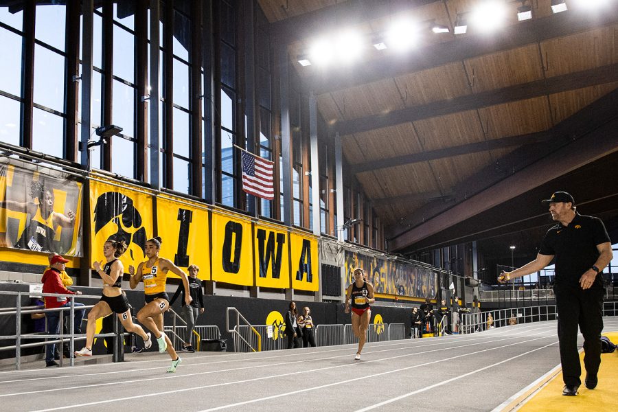 Iowa’s Paige Magee runs during the 2023 Hawkeye Invitational at the University of Iowa Recreation Building in Iowa City on Saturday, Jan. 14, 2022. The Hawkeye Invitational hosted Ball State, Bradley, Indian Hills, Iowa, Iowa Central, Missouri, Northern Iowa, Western Illinois, Wis.-River Falls, and unattached individuals.