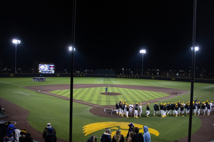 Iowa’s and Loras’ baseball teams leave the field after a baseball game at Duane Baseball Field in Iowa City on Tuesday, Feb. 28, 2023. The Hawkeyes defeated the Duhawks, 9-2.