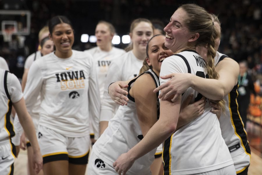 Iowa guard Gabbie Marshall embraces Iowa guard Kate Martin after a women’s basketball game between No. 7 Iowa and Purdue at Target Center in Minneapolis on Friday, March 3, 2023. The Hawkeyes defeated the Boilermakers, 69-58.