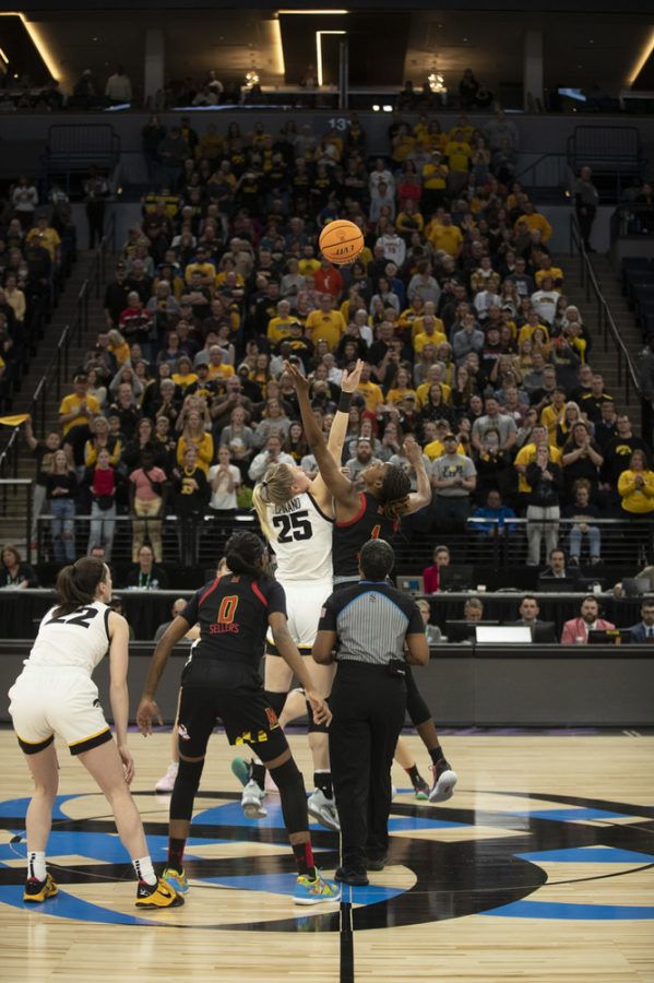 Iowa center Monika Czinano and Maryland guard Diamond Miller jump for the ball during tip-off at a women’s basketball game between No. 7 Iowa and No. 5 Maryland at Target Center in Minneapolis on Saturday, March 4, 2023. The Hawkeyes defeated the Terrapins, 89-84.