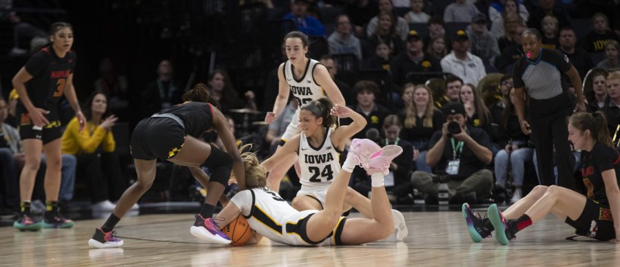 Iowa guard Sydney Affolter dives for the ball during a women’s basketball game between No. 7 Iowa and No. 5 Maryland at Target Center in Minneapolis on Saturday, March 4, 2023. The Hawkeyes defeated the Terrapins, 89-84.