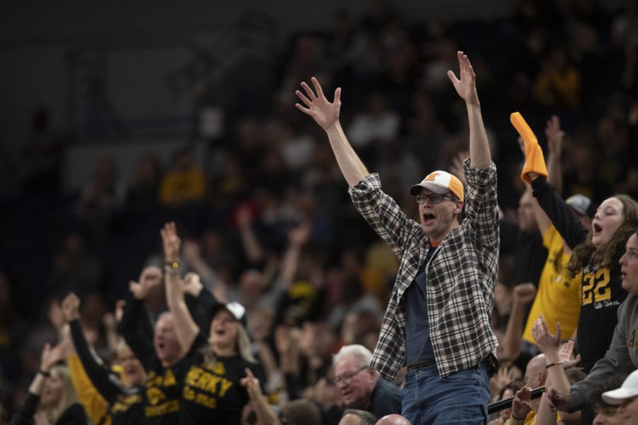 Iowa fans react during a women’s basketball game between No. 7 Iowa and No. 5 Maryland at Target Center in Minneapolis on Saturday, March 4, 2023. The Hawkeyes defeated the Terrapins, 89-84.