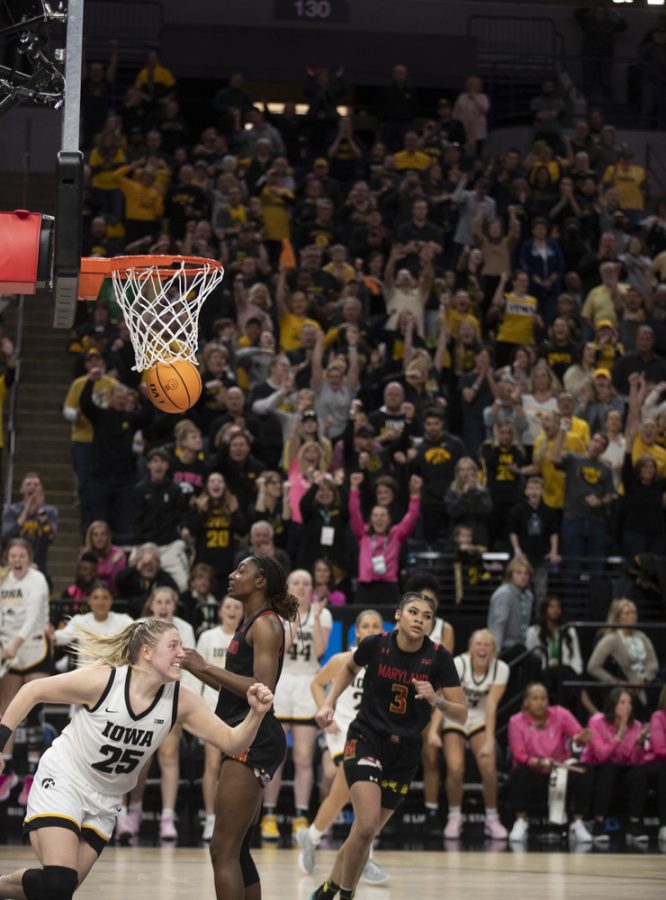 Iowa center Monika Czinano runs downcourt after scoring during a women’s basketball game between No. 7 Iowa and No. 5 Maryland at Target Center in Minneapolis on Saturday, March 4, 2023. The Hawkeyes defeated the Terrapins, 89-84. Czinano scored 15 points and had 8 rebounds.