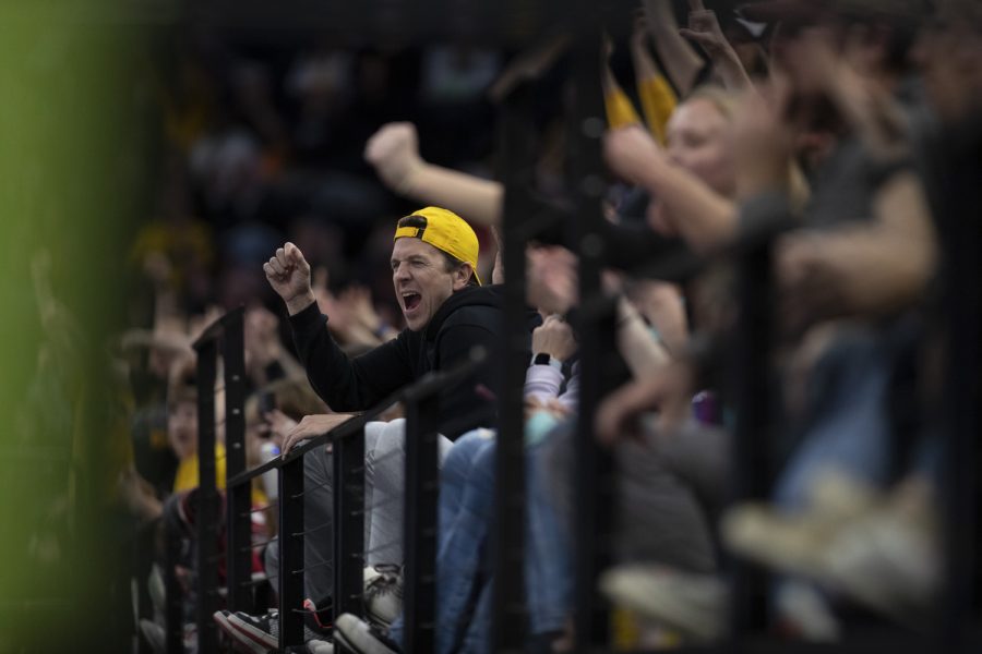 Iowa fans react during a women’s basketball game between No. 7 Iowa and No. 5 Maryland at Target Center in Minneapolis on Saturday, March 4, 2023. The Hawkeyes defeated the Terrapins, 89-84.