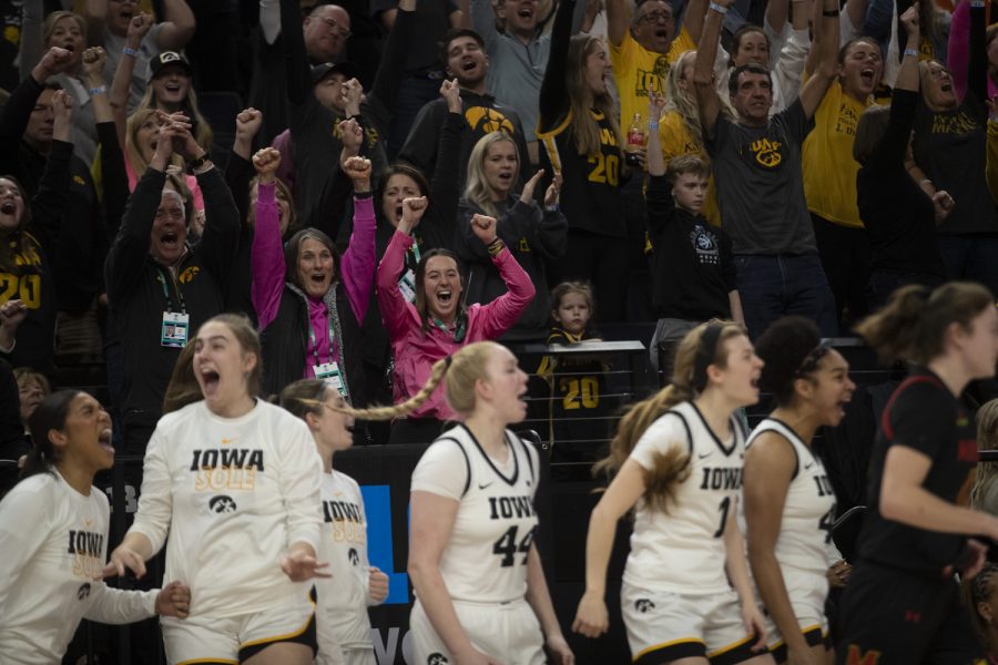 Iowa fans and teammates react during a women’s basketball game between No. 7 Iowa and No. 5 Maryland at Target Center in Minneapolis on Saturday, March 4, 2023. The Hawkeyes defeated the Terrapins, 89-84.