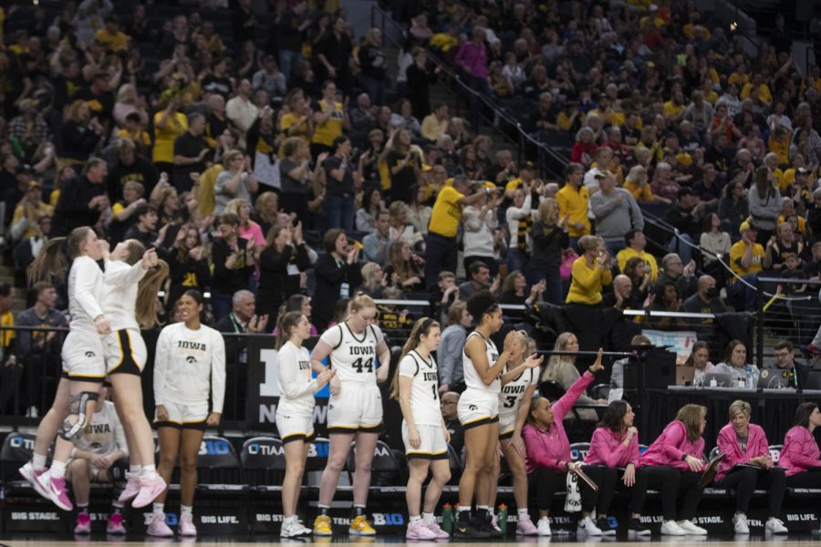 Iowa teammates react during a women’s basketball game between No. 7 Iowa and No. 5 Maryland at Target Center in Minneapolis on Saturday, March 4, 2023. The Hawkeyes defeated the Terrapins, 89-84.