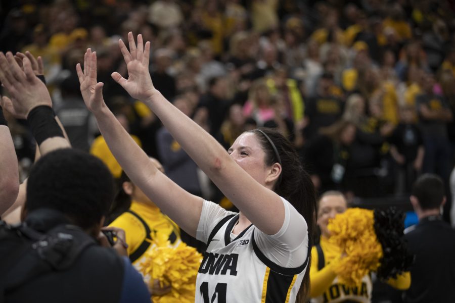 Iowa forward McKenna Warnock celebrates after winning a women’s basketball game between No. 7 Iowa and No. 5 Maryland at Target Center in Minneapolis on Saturday, March 4, 2023. The Hawkeyes defeated the Terrapins, 89-84. Warnock scored 21 points and had 8 rebounds.