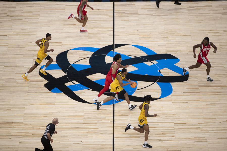 Iowa guard Tony Perkins runs the ball down court during a men’s basketball game between Iowa and Ohio State at United Center in Chicago on Thursday, March 9, 2023. The Buckeyes defeated the Hawkeyes, 73-69.
