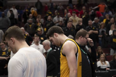 Iowa forward Filip Rebraca walks off the court after losing a men’s basketball game between Iowa and Ohio State at United Center in Chicago on Thursday, March 9, 2023. The Buckeyes defeated the Hawkeyes, 73-69.