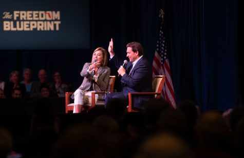 Iowa Gov. Kim Reynolds and Florida Gov. Ron DeSantis say goodbye during “The Freedom Blueprint” a Republican hosted event in Davenport, Iowa on Friday, March 10, 2023. Reynolds and DeSantis received a standing ovation. 