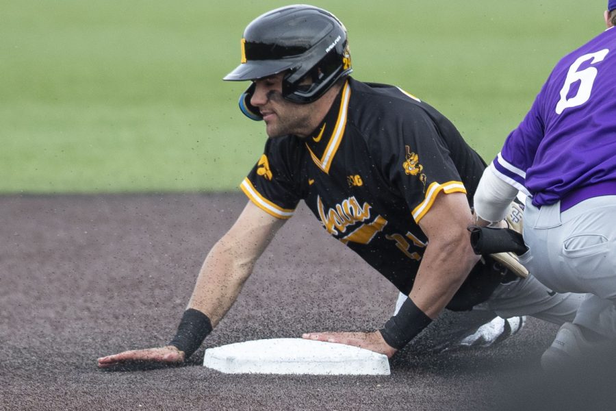 Iowa first baseman Brennen Dorighi steals second base during a baseball game between Iowa and St. Thomas at Duane Banks Field in Iowa City on Wednesday, March 15, 2023. The Hawkeyes defeated the Tommies, 10-1.