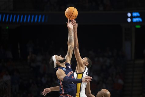Auburn forward Johni Broome and Iowa forward Kris Murray jump for the ball during tip off at a men’s basketball game between Iowa and Auburn in the first round of the NCAA Tournament at Legacy Arena in Birmingham, Alabama on Thursday, March 16, 2023. The Tigers defeated the Hawkeyes, 83-75.