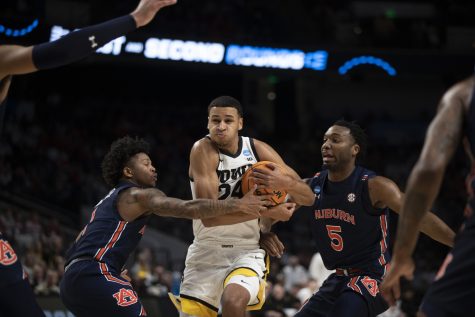 Iowa forward Kris Murray fights through Auburn players during a men’s basketball game between Iowa and Auburn in the first round of the NCAA Tournament at Legacy Arena in Birmingham, Ala., on Thursday, March 16, 2023. The Tigers defeated the Hawkeyes, 83-75.