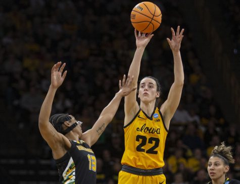 Iowa guard Caitlin Clark shoots a three point shot during a 2022 NCAA First Round women’s basketball game between No. 2 Iowa and No. 16 Southeastern Louisiana in sold-out Carver-Hawkeye Arena on Friday, March 16, 2023.