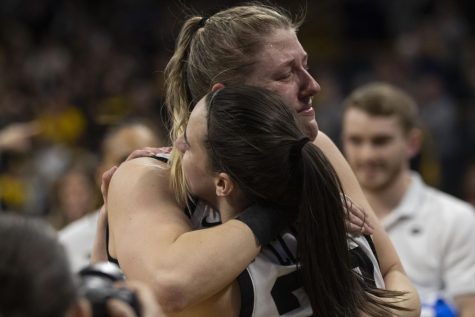 Iowa center Monika Czinano hugs teammate Caitlin Clark after winning the 2023 NCAA Second Round women’s basketball game over No.10 Georgia at a sold-out Carver Hawkeye Arena on Sunday, March 19, 2022. The Hawkeyes defeated the Lady Bulldogs, 74-66. Cziznano scored 22 points in the victory.
