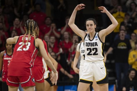 Iowa guard Caitlin Clark hypes up the crowd during the 2023 NCAA Second Round women’s basketball game between No. 2 Iowa and No. 10 Georgia at a sold-out Carver Hawkeye Arena on Sunday, March 19, 2022. The Hawkeyes defeated the Lady Bulldogs, 74-66.