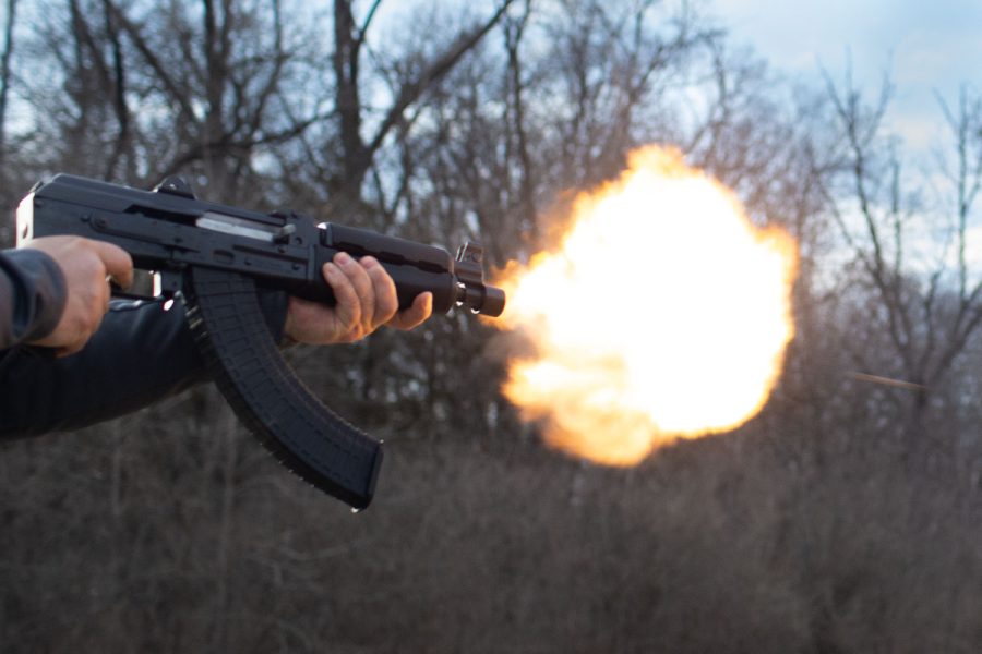 A gun owner fires a gun at the Hawkeye Wildlife Shooting Range in Amana, Iowa on March 20, 2023.