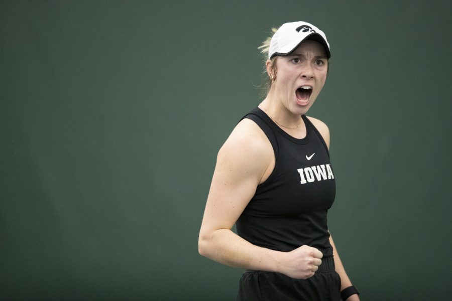 Iowa’s Smantha Mannix celebrates during a women’s tennis meet at the Hawkeye Tennis and Recreational Complex in Iowa City, on Saturday, March 25, 2023. Mannix won her singles match ending, 6-3.