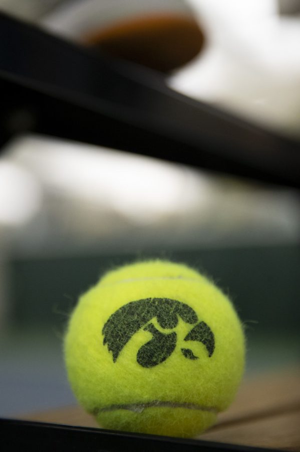 An tennis ball with the Hawkeye logo sits during a women’s tennis meet at the Hawkeye Tennis & Recreational Complex in Iowa City, on Saturday, March 25, 2023. The Hawkeyes defeated the Corn Huskers, 4-1.