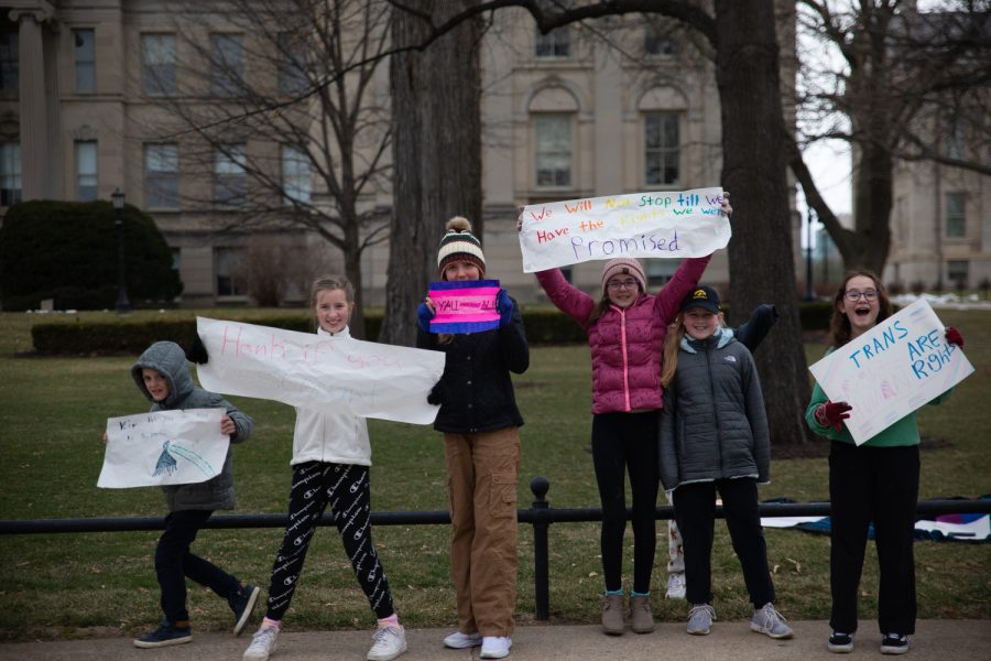 Student protesters from the Iowa City Community School District hold signs protesting the bathroom bill on the Pentacrest in Downtown Iowa City on Sunday, March 26, 2023. 