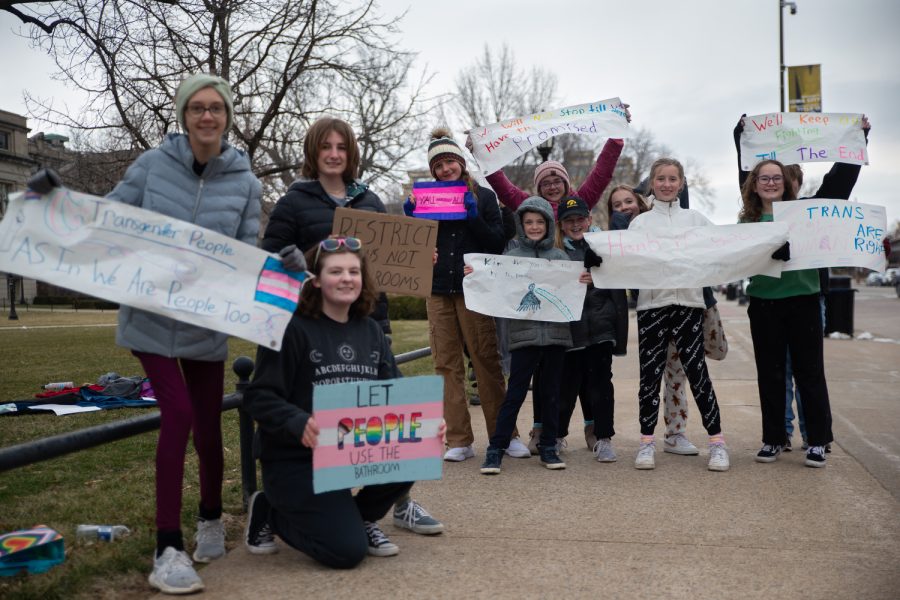 Student protesters from the Iowa City Community School District hold signs protesting the bathroom bill on the Pentacrest in Downtown Iowa City on Sunday, March 26, 2023. (Matt Sindt/The Daily Iowan)