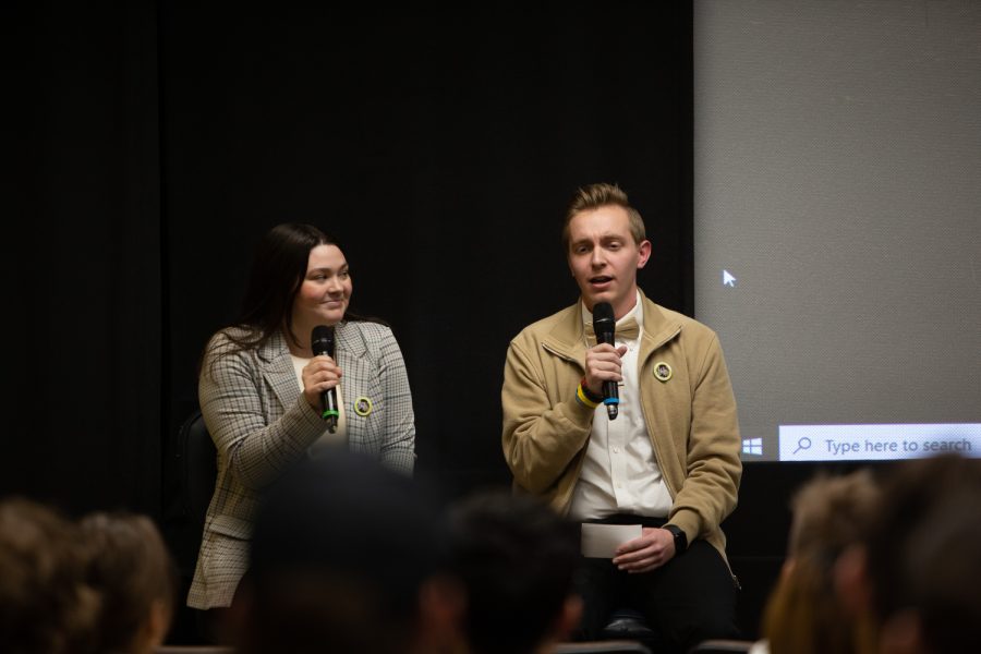 Candidates Carly O’Brien and Mitch Winterlin speak during a University of Iowa Undergraduate Student Government debate in the Iowa Theater in the Iowa Memorial Union on March 26, 2023.