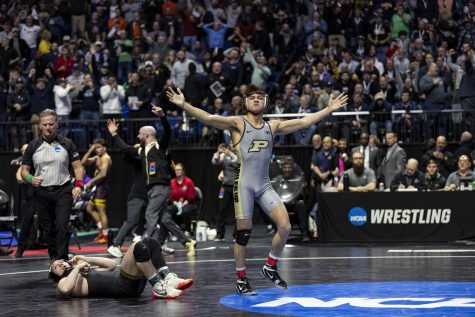 Purdues Matt Ramos celebrates after pinning Iowas three-time national champion Spencer Lee in the semi-finals of the NCAA Wrestling Championships at BOK Center in Tulsa, Okla. on Friday, March 17, 2023. 