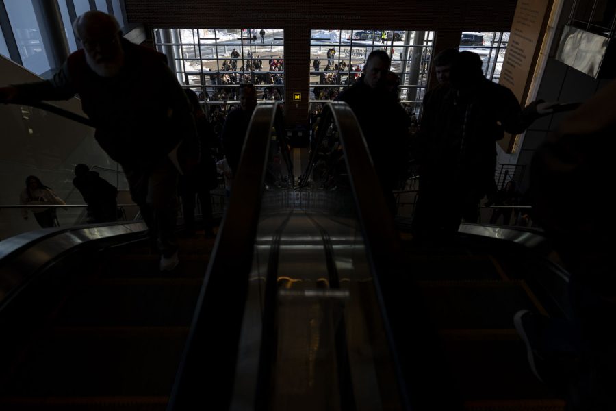 Fans enter Crisler Center before session one of the Big Ten Wrestling Championships in Ann Arbor, Mich. on Saturday, March. 4, 2023. 