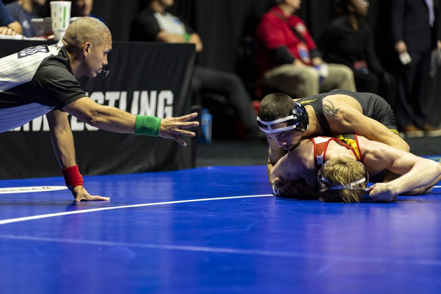 No.+1+seeded+141-pound+Iowas+Real+Woods+wrestles+No.+32+seeded+141-pound+Marylands+Kal+Miller+as+an+official+signals+for+a+four-point+near+fall+during+session+one+of+the+NCAA+Wrestling+Championships+at+BOK+Center+in+Tulsa%2C+Okla.+on+Thursday%2C+March+16%2C+2023.+Woods+defeated+Miller+by+major+decision%2C+13-1.