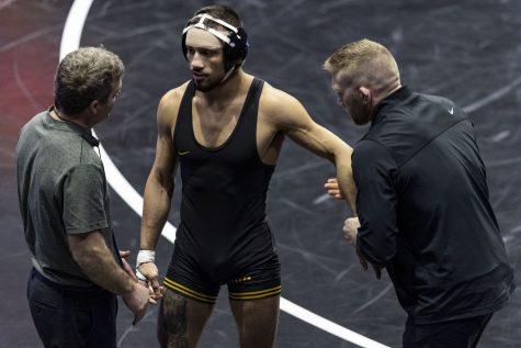 No. 1 seeded 141-pound Iowas Real Woods talks with Iowa head coach Tom Brands during Session II of the NCAA Wrestling Championships at BOK Center in Tulsa, Okla. on Thursday, March 16, 2023.