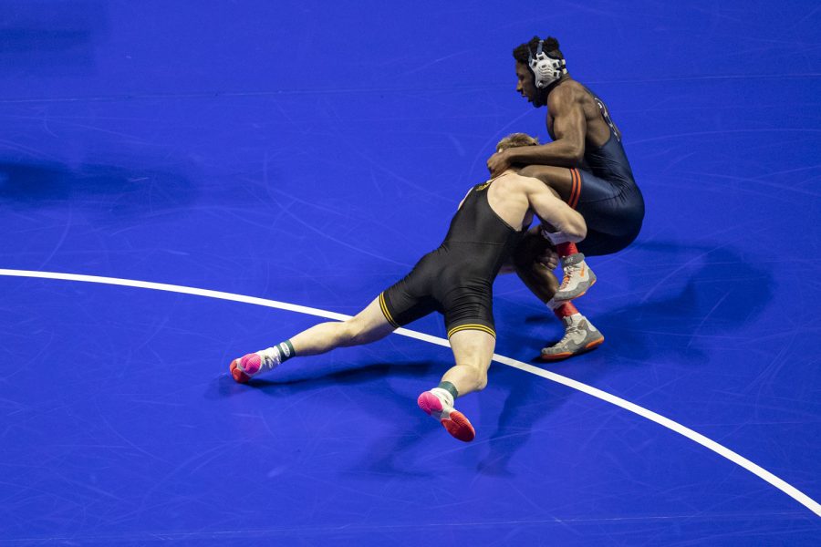 No. 11 seeded 174-pound Iowas Nelson Brands wrestles No. 9 seeded 174-pound Illinois Edmond Ruth during session four of the NCAA Wrestling Championships at BOK Center in Tulsa, Okla. on Friday, March 17, 2023. Brands defeated Ruth by decision, 4-1.