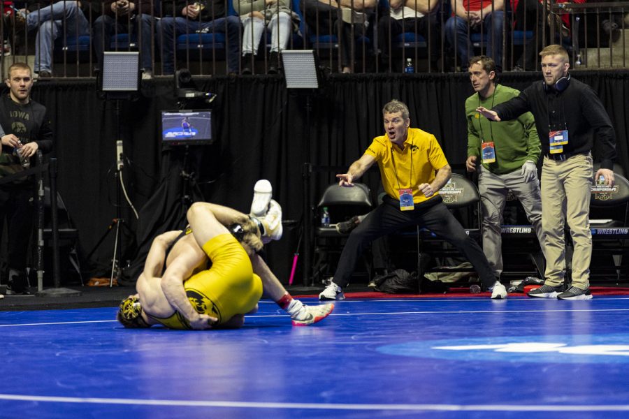 Iowa+head+coach+Tom+Brands+and+Iowa+associate+head+coach+signal+for+points+as+No.+11+seeded+174-pound+Iowas+Nelson+Brands+wrestles+No.+7+seeded+174-pound+Mizzous+Peyton+Mocco+during+session+four+of+the+NCAA+Wrestling+Championships+at+BOK+Center+in+Tulsa%2C+Okla.+on+Friday%2C+March+17%2C+2023.+Brands+defeated+Mocco+by+decision%2C+6-1.+