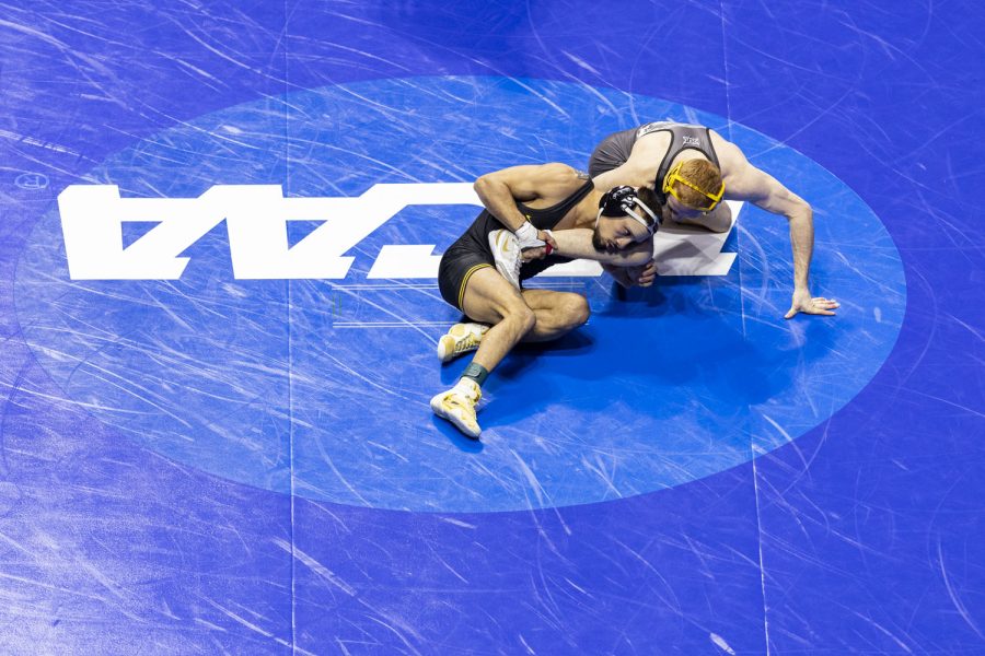 No. 1 seeded 141-pound Iowas Real Woods wrestles No. 8 seeded 141-pound Mizzous Allan Hart during session three of the NCAA Wrestling Championships at BOK Center in Tulsa, Okla. on Friday, March 17, 2023. Woods defeated Hart by major decision, 9-0.