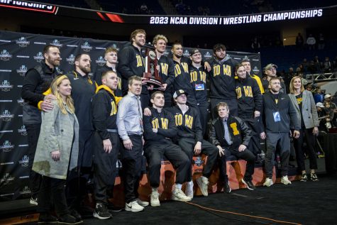 The Iowa wrestling team poses for a team picture after session six of the NCAA Wrestling Championships at BOK Center in Tulsa, Okla. on Saturday, March 18, 2023. Iowa finished second in team points with 82.5.