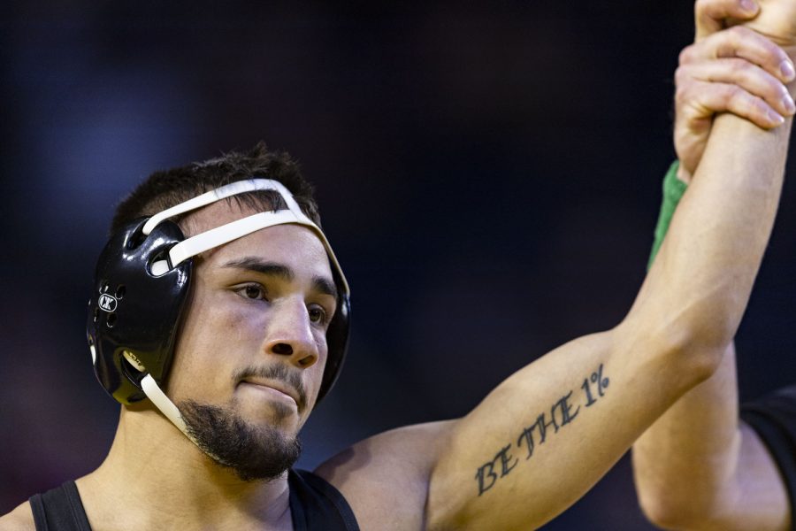 No. 1 seeded 141-pound Iowa's Real Woods looks to the crowd after defeating No. 8 seeded Purdue’s Parker Filius during session one of the Big Ten Wrestling Championships at Crisler Center in Ann Arbor, Mich. on Saturday, March. 4, 2023. Woods defeated Filius by fall, 2:08.