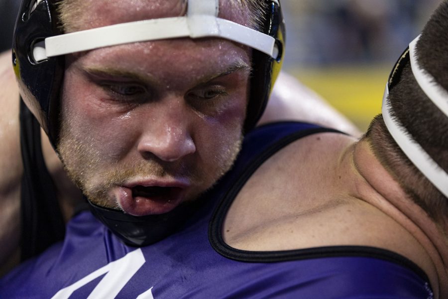 No. 3 seeded 165-pound Iowas Patrick Kennedy wrestles No. 6 seeded 165-pound Northwestern’s Maxx Mayfield during session one of the Big Ten Wrestling Championships at Crisler Center in Ann Arbor, Mich. on Saturday, March 4, 2023. Kennedy defeated Mayfield by major decision, 11-3.